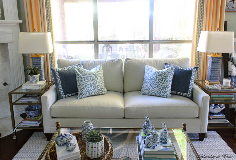 blue velvet pillows with trim and patterned pillows