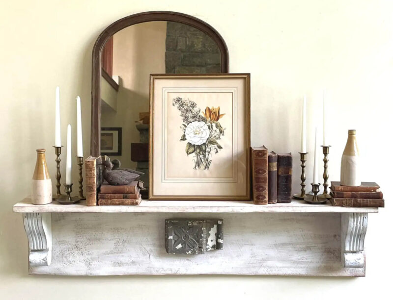 fall accessories grouping on a chippy white shelf