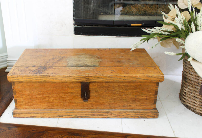antique chest on hearth of fireplace