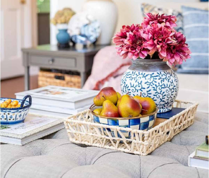colorful fall centerpiece with blue and white vase and burgudy flowers