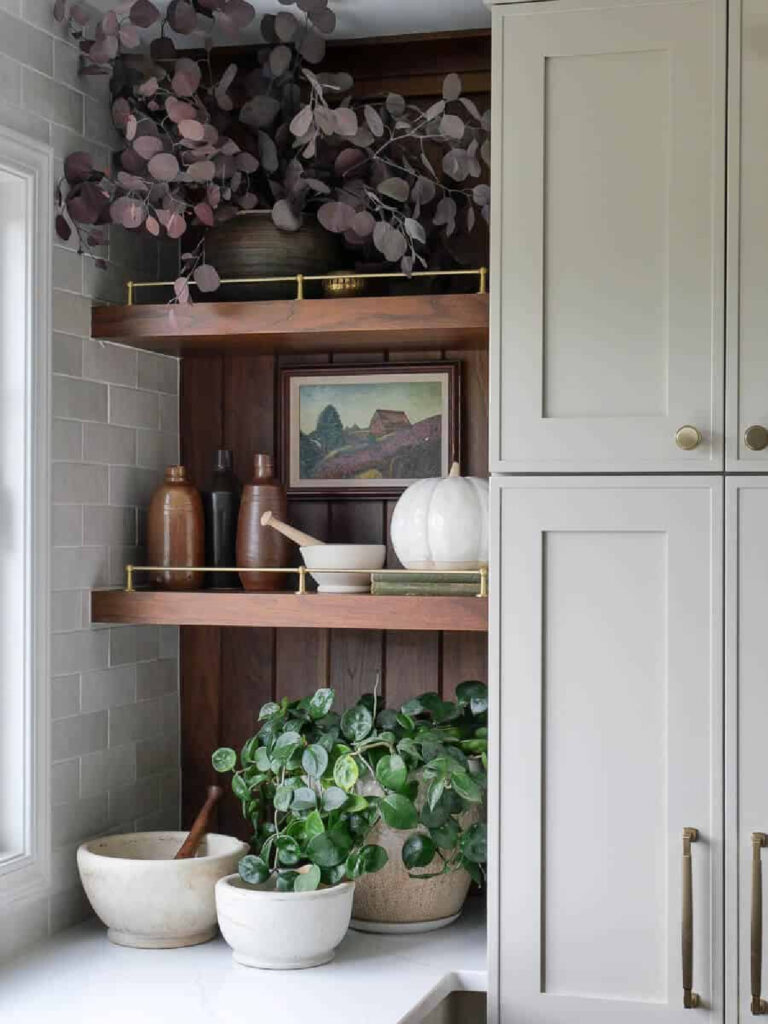 fall decor on wood shelf in kitchen
