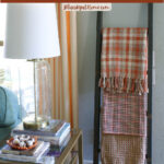 blanket ladder decorated with fall plaid and patterned throw blankets