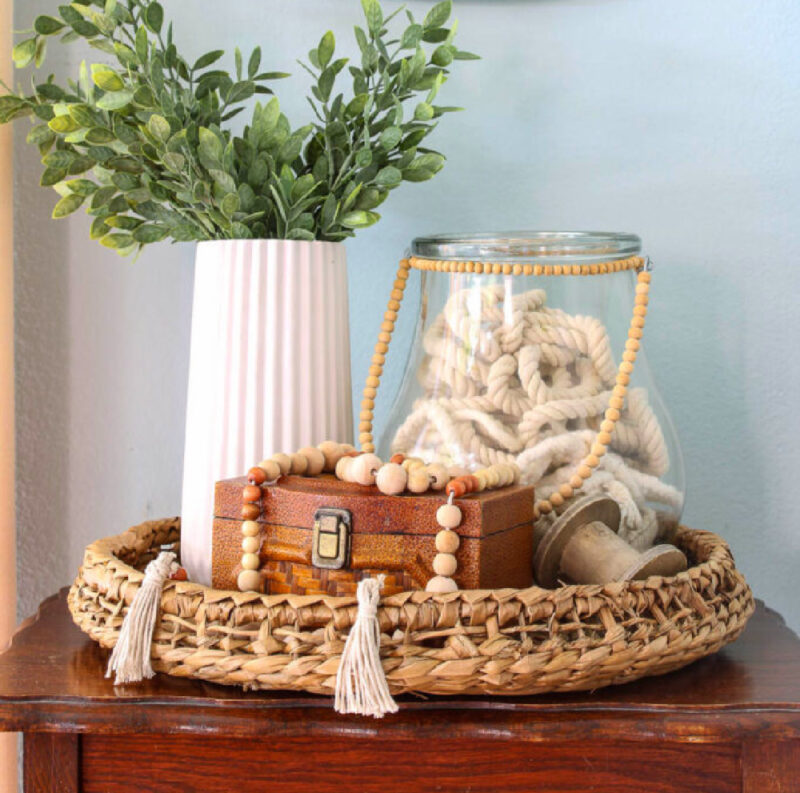 accessory glass vase filled with natural rope on a table for fall