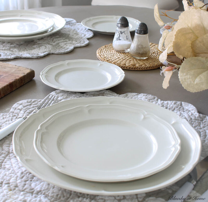 salt and pepper shakers on round woven trivet