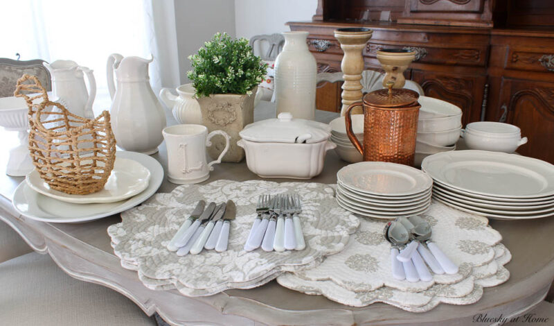 white and netural accessories for styling a hutch