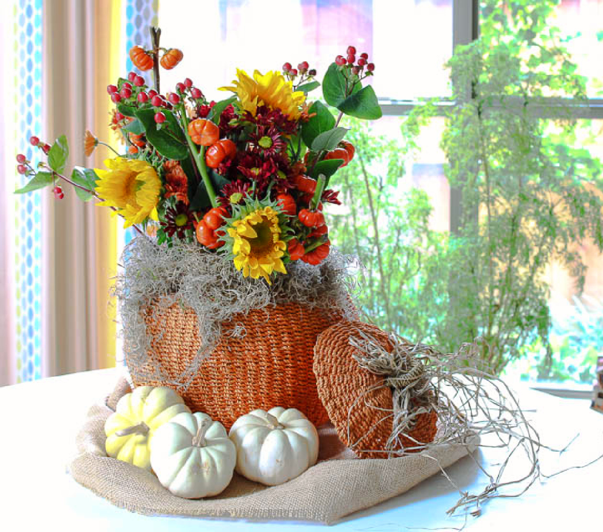 orange woven pumpkin basket filled with flowers