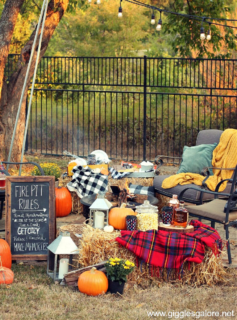 fall outdoors bonfire party with haybales and red and black plaid blankets.