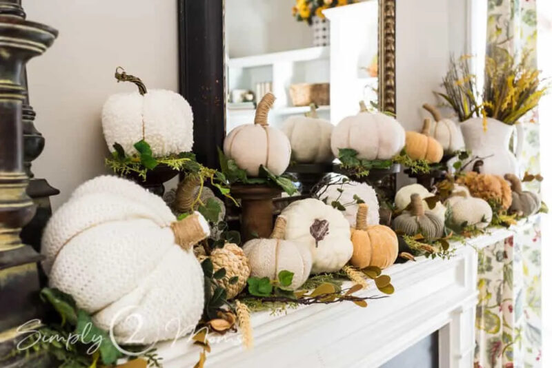 fall green foliage with white pumpkins on the fall mantel