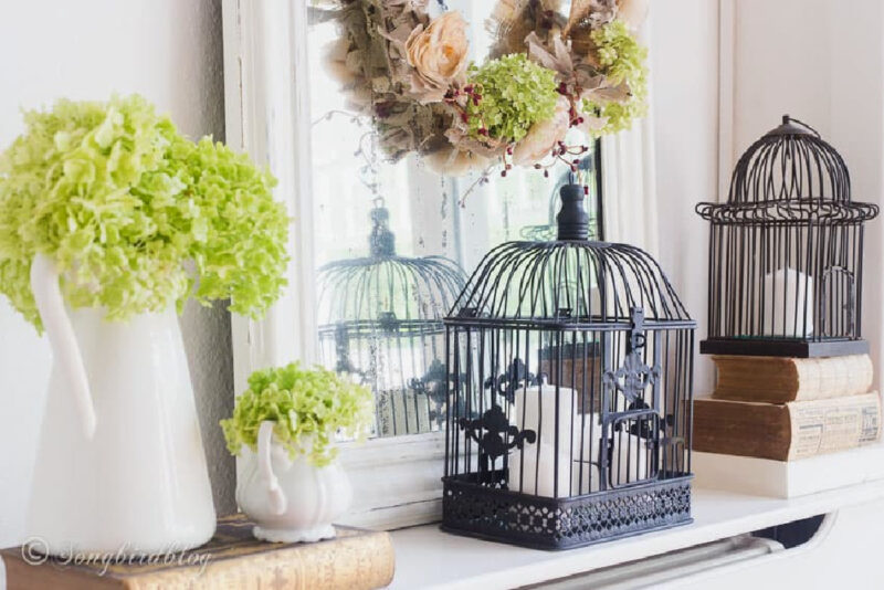 romantic fall mantel with birdcages and lime hydrangeas