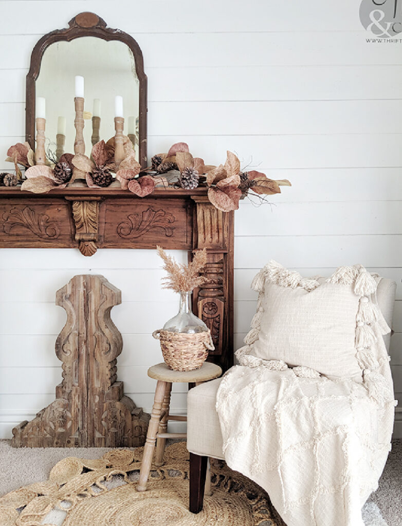 rustic faux fall mantel decorated with candlesticks