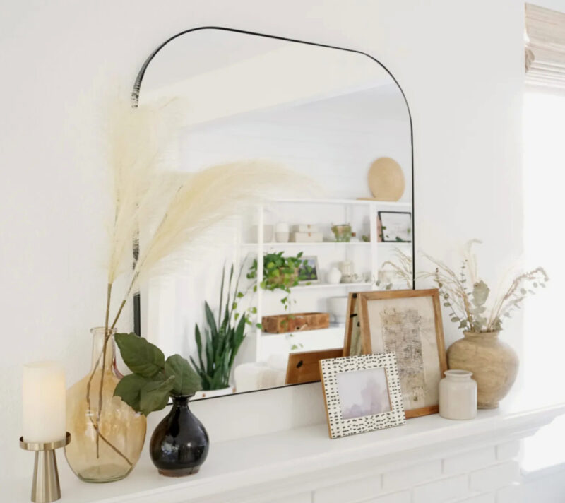 fall mantel with square mirror and framed pictures