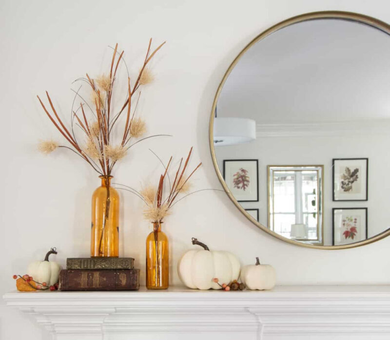 fall mantel with mirror and pumpkins