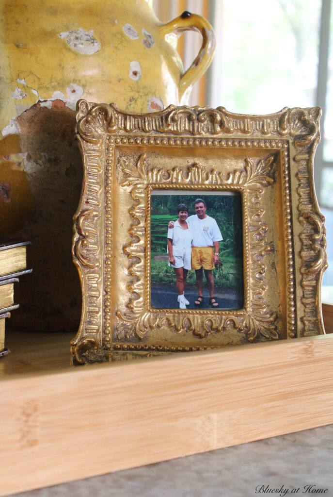 gold picture frame of man and woman