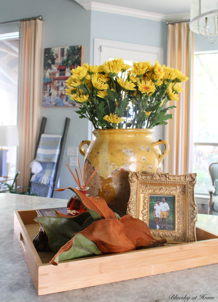 magnolia stem on wood tray 