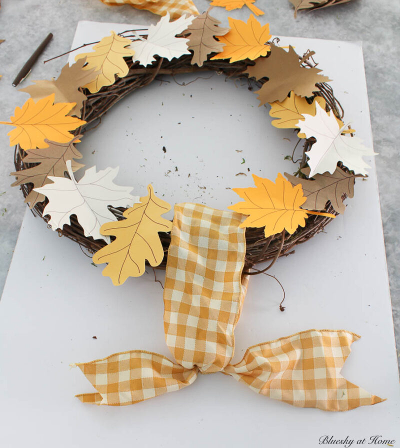gold and white gingham ribbon tied on wreath