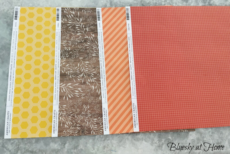 scrapbook paper in fall colors gold, orange strip and check
