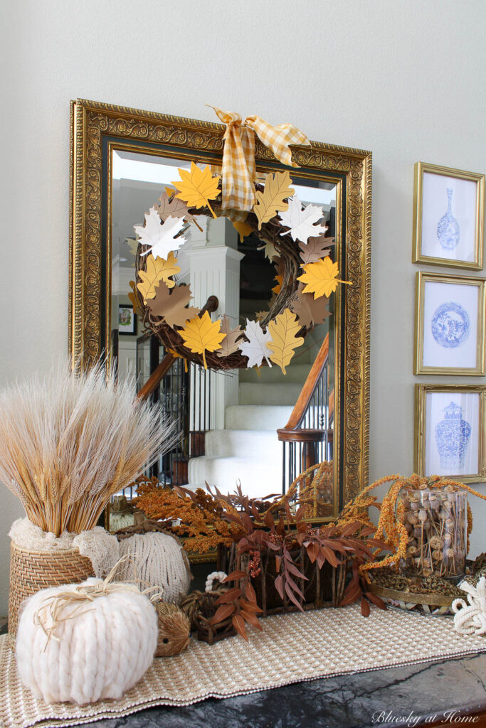 grapevine wreath with colored paper leaves