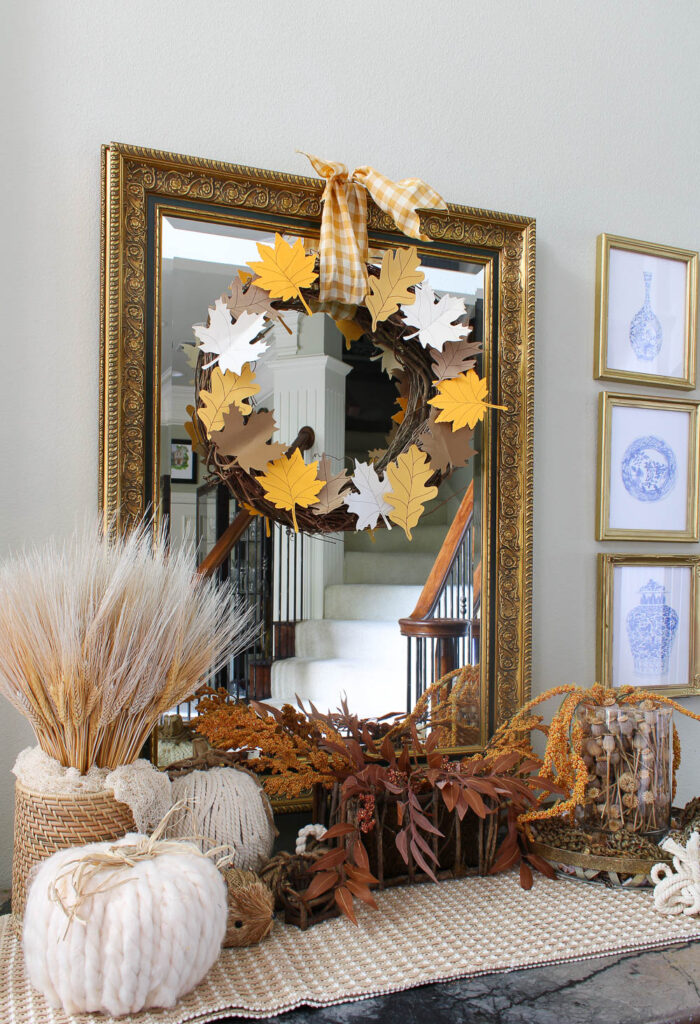 grapevine wreath with colored paper leaves