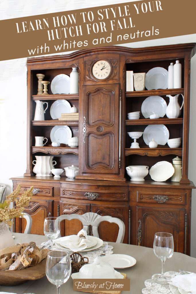 styled brown hutch for fall with white dishes and accessories