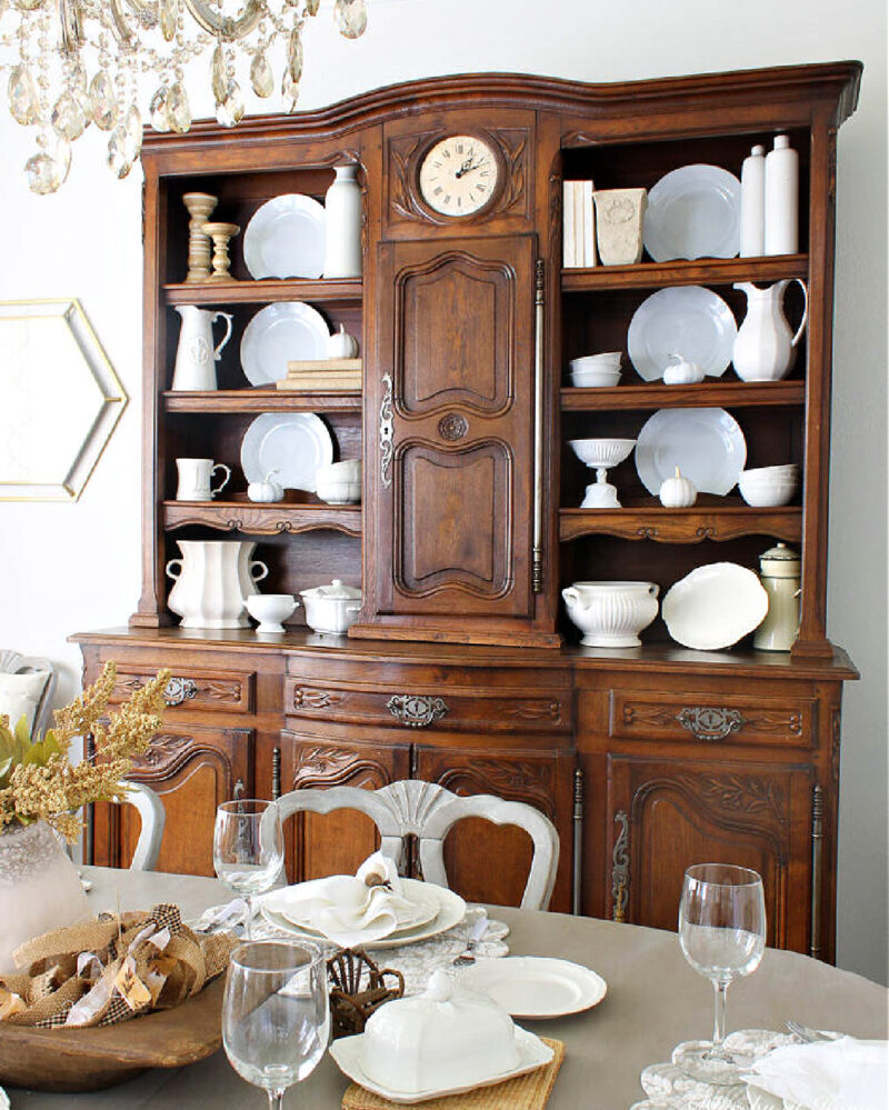 styled hutch in cream and white dishes