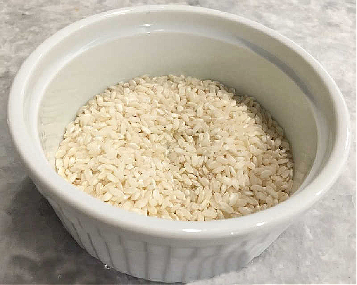 Pumpkin Risotto Bites Need to Be in Your Recipe Box ~ an easy, make~ahead appetizer that your guests will love and you will love to serve. aborio rice in whtie ramekin