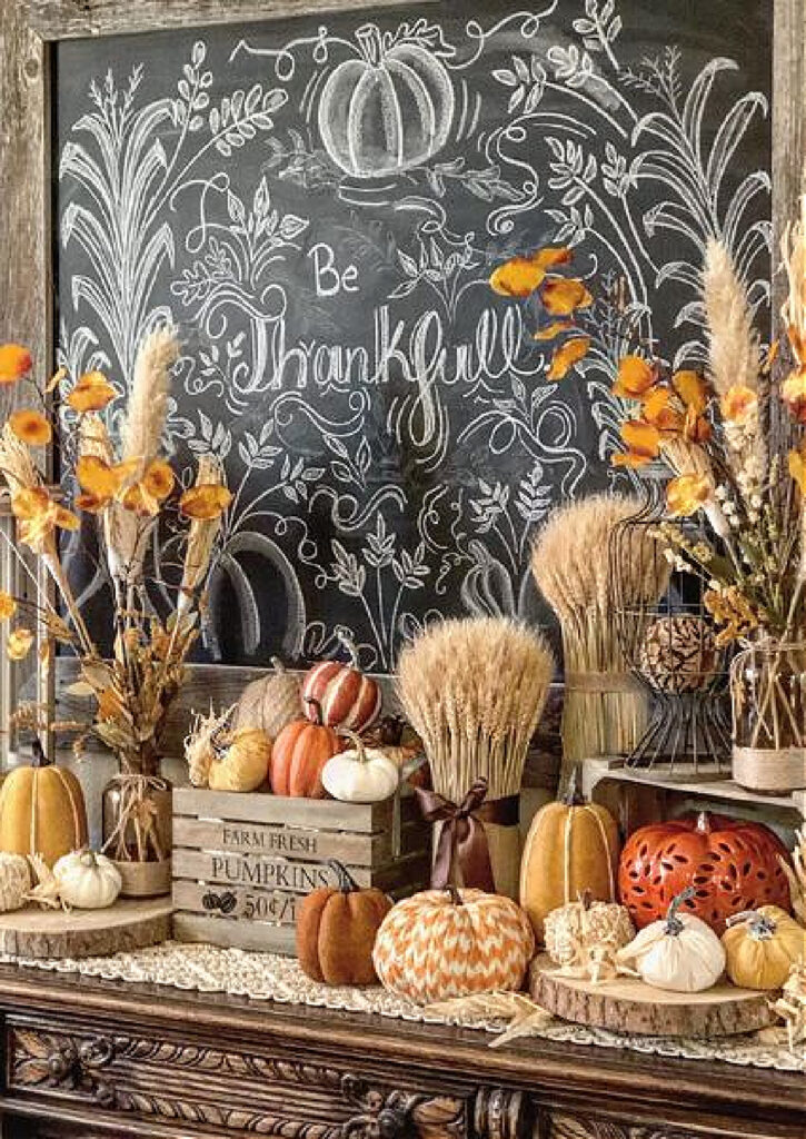 Thanksgiving sign and decorations of pumpkins and white