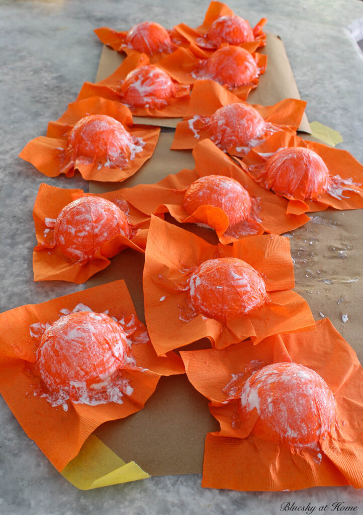 orange napkin on styrofoam balls drying