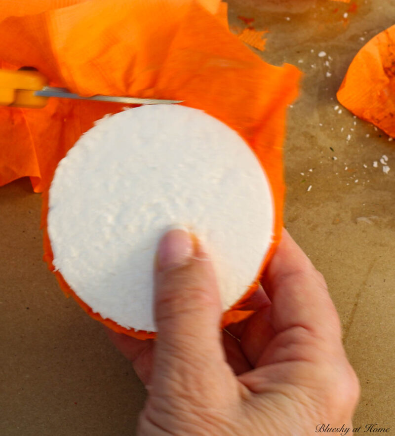 trimming paper around styrofoam balls