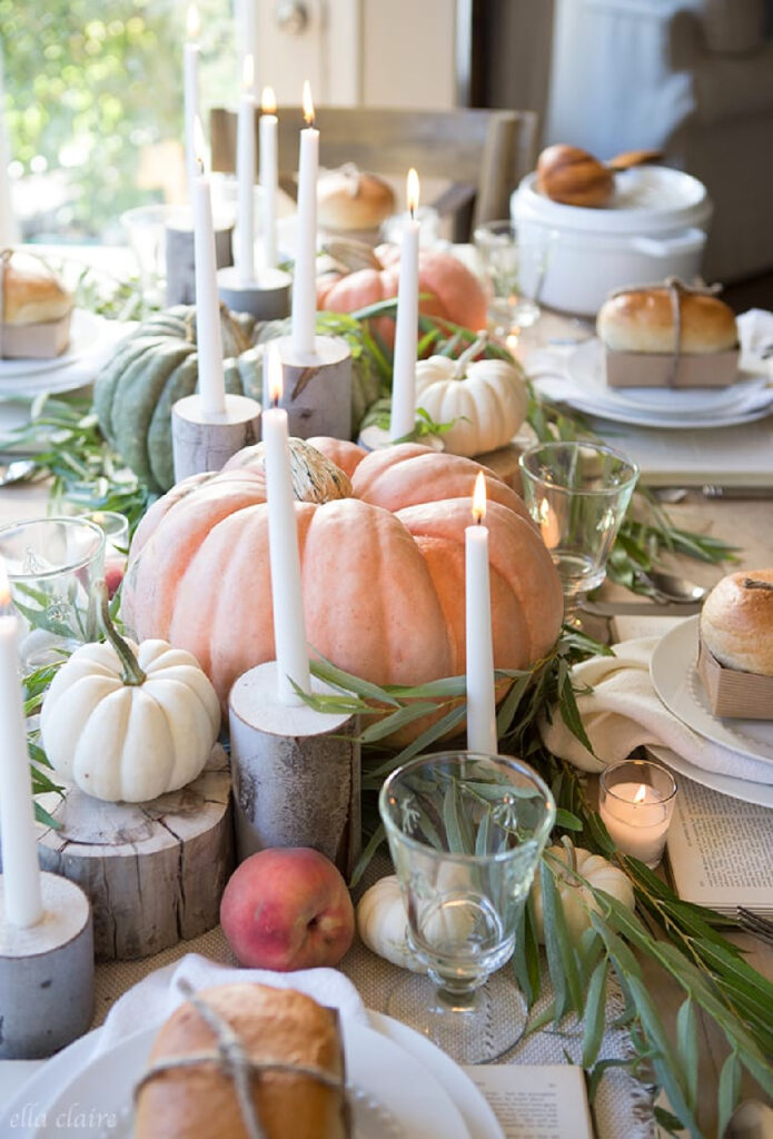 Thanksgiving table setting with large pumpkins