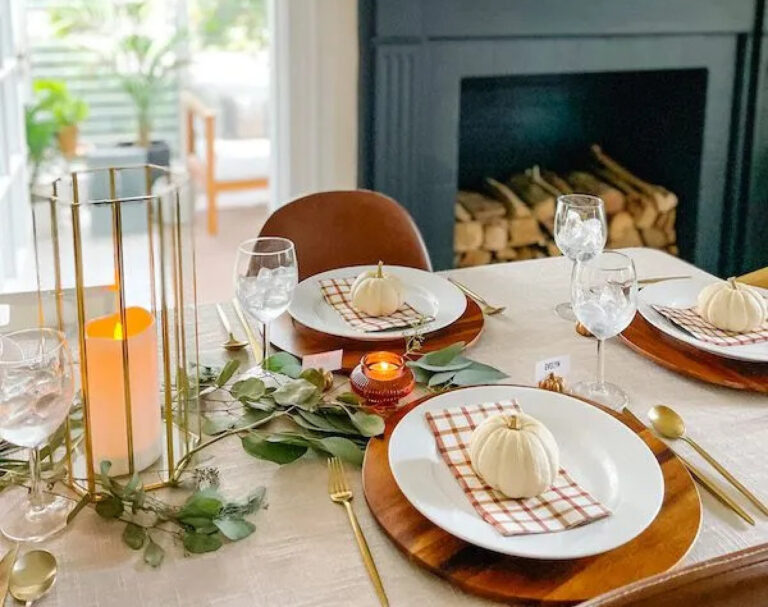 check napkins and pumpkins on Thanksgiving table setting