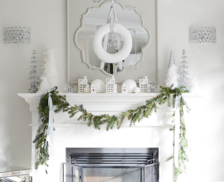 White mantel decorated for Christmas decor