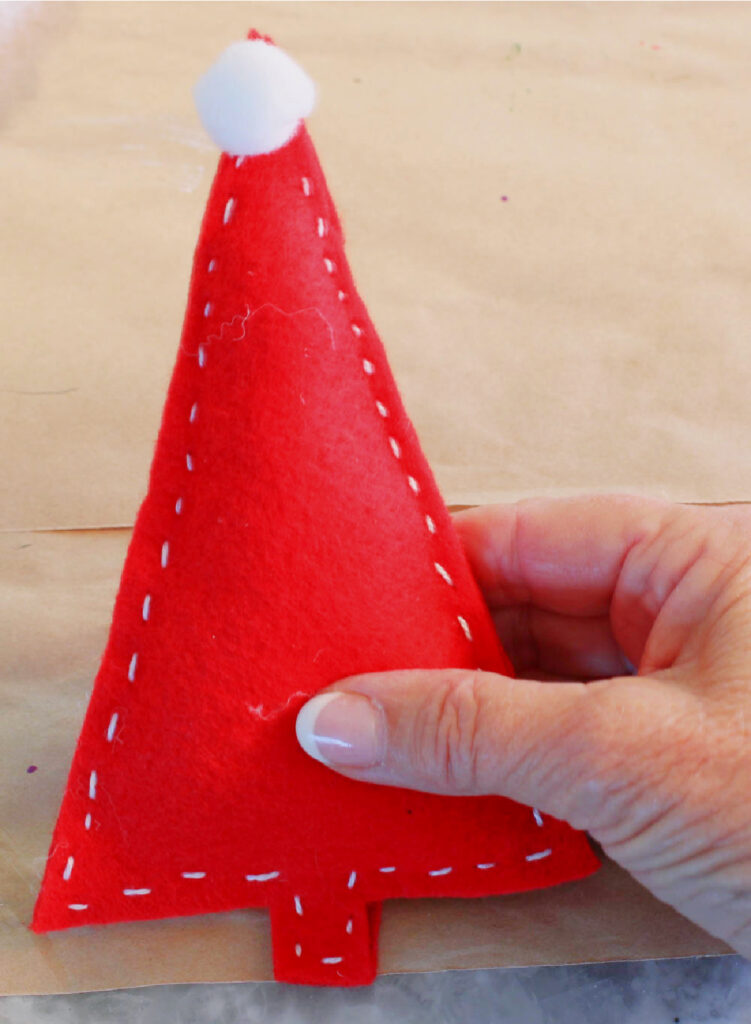 red felt Christmas tree with white pom-pom top