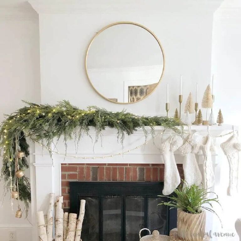 white mantel with garland and stockings