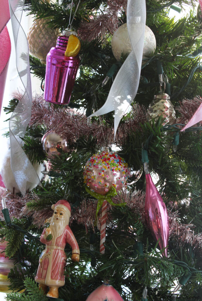 vintage ornaments on pink tabletop Christmas tree