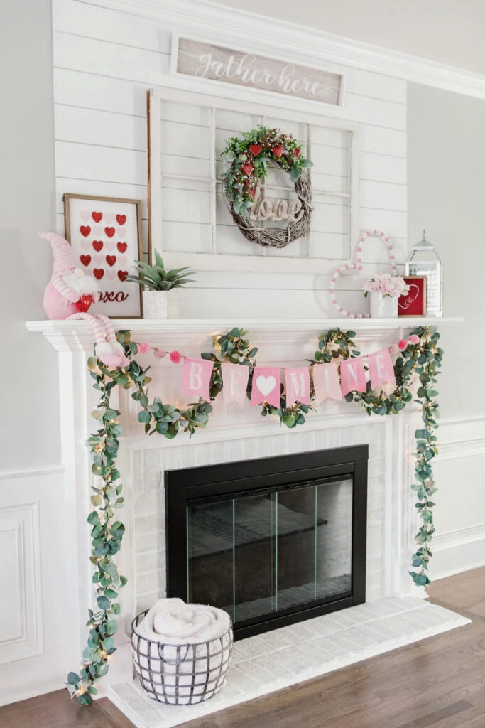 Valentine's home decor with mantel with greenery and banner