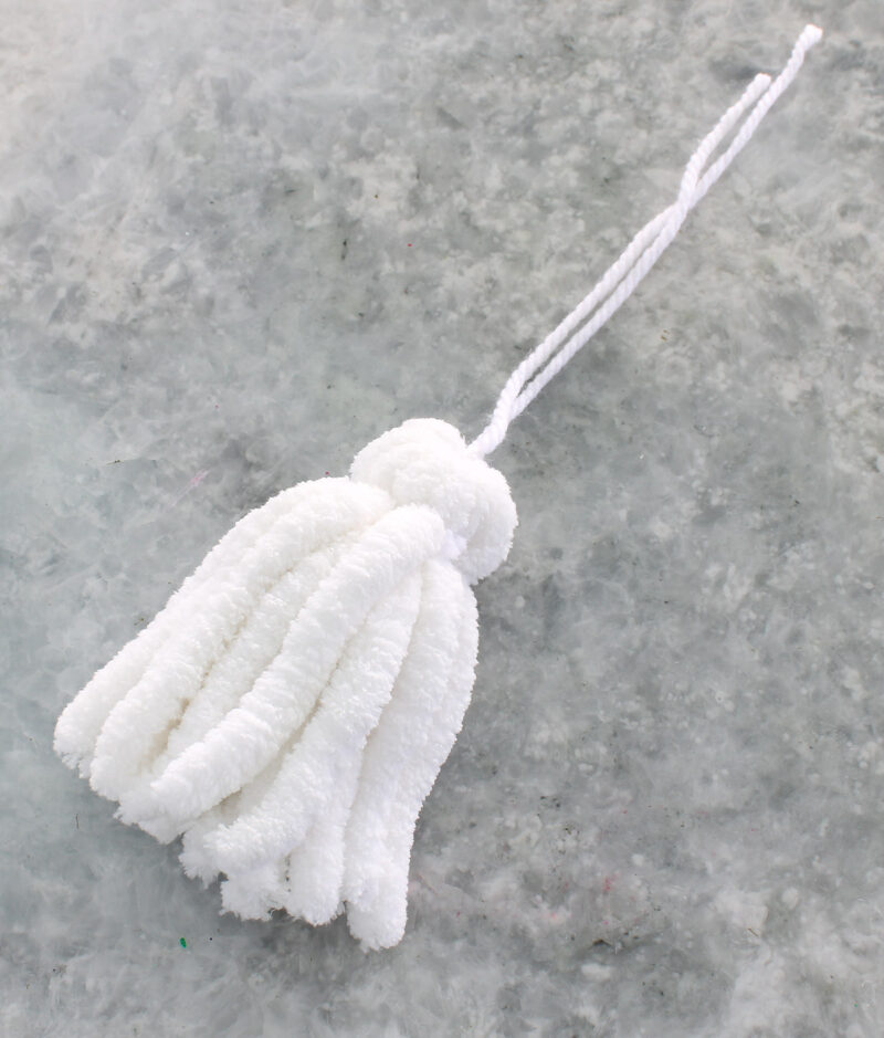 white yarn tassel