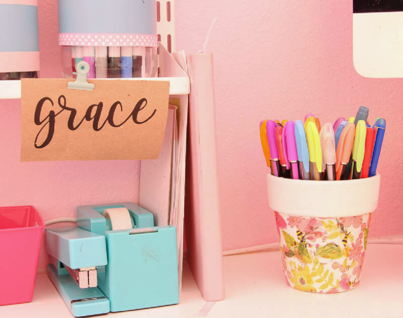 colored pens and markers in decoupaged flower pot