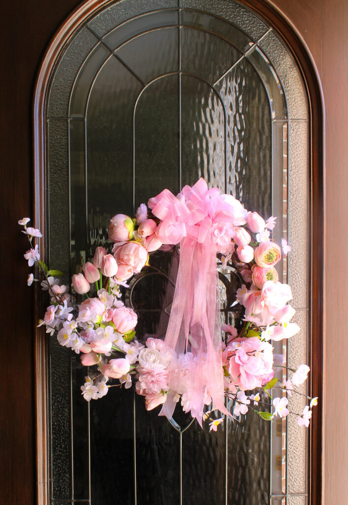 garden-style spring wreath on front door