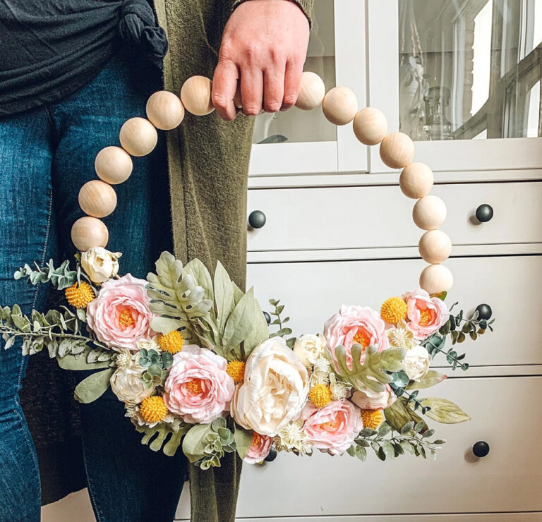 spring wreath with large beads and lush coral colors