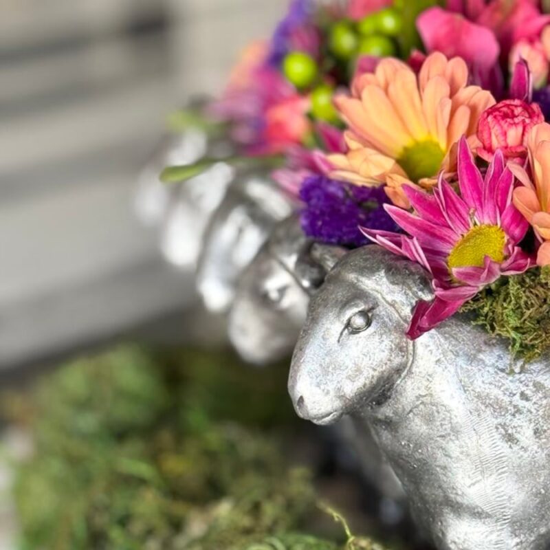 colorful flowers in silver planter for spring decor