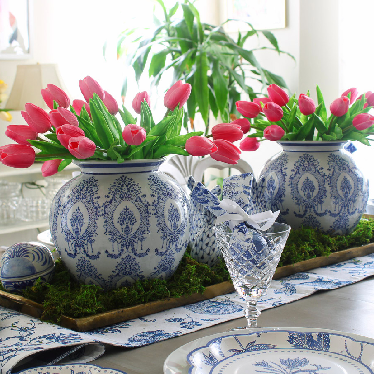 pink tulips in bue adn white chinoiserie voses on Easter table