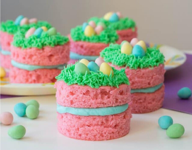 pink mini cakes green grass icing and blue filling