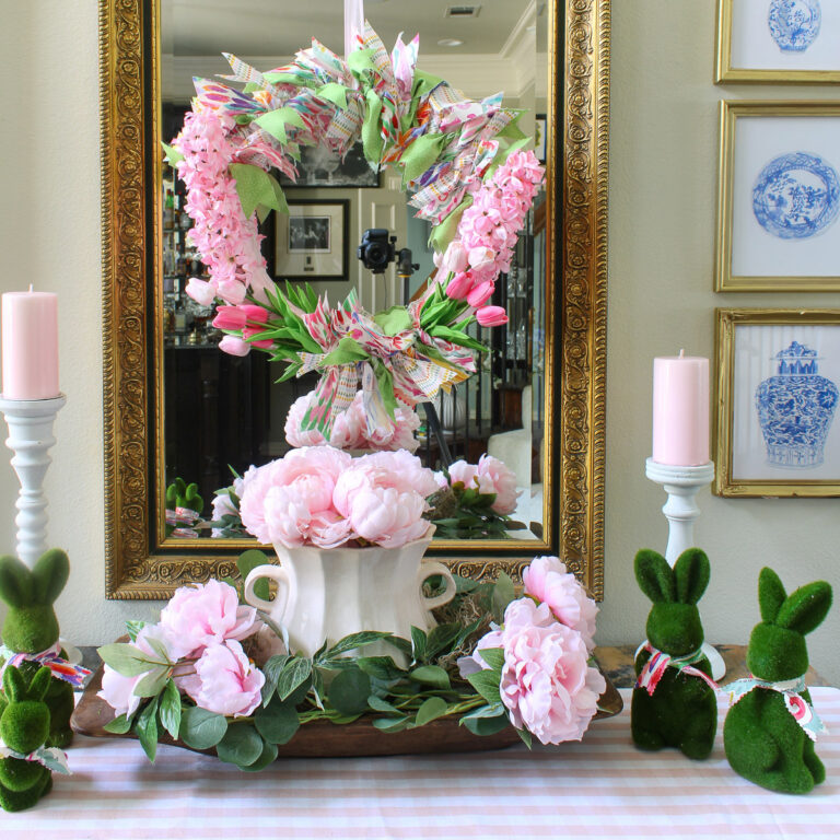spring wreath with spring colored fabrics and pink flowers