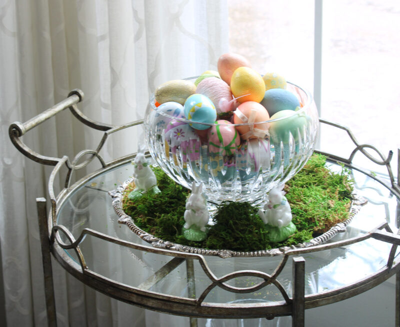 Easter eggs in glass bowl on bar cart