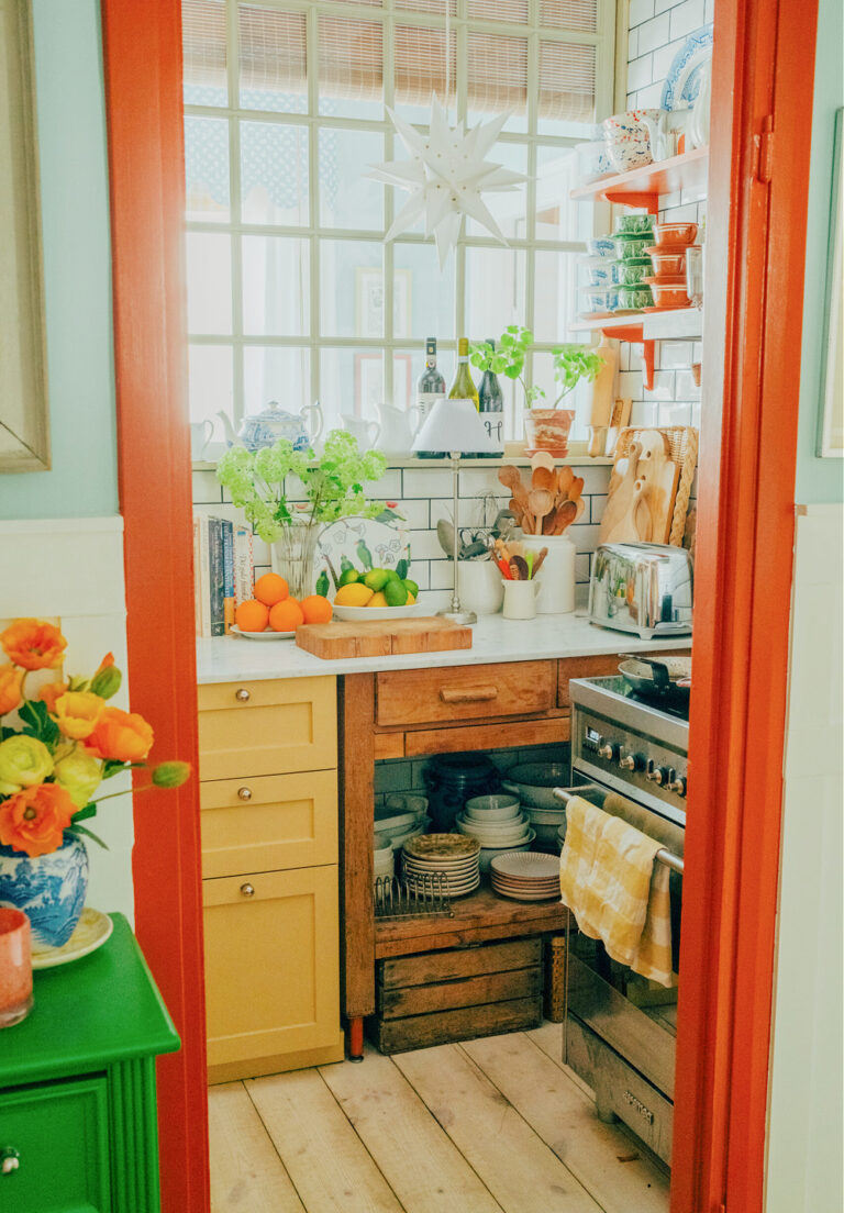 small Swedish kitchen with yellow and orange accents