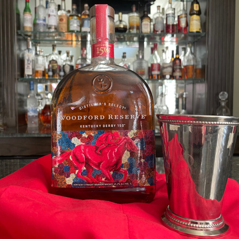 Woodford Reserve bourbon with silver Mint Julep glass for Mint Julep