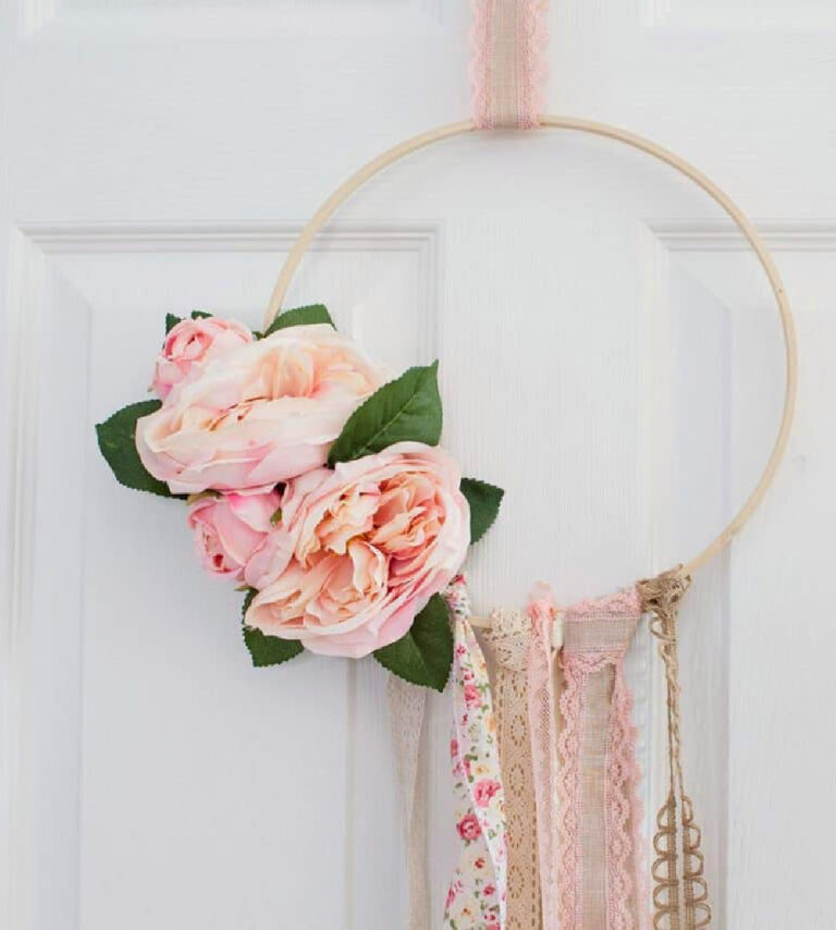 boho style hoop wreath in pink ribbons and flowers