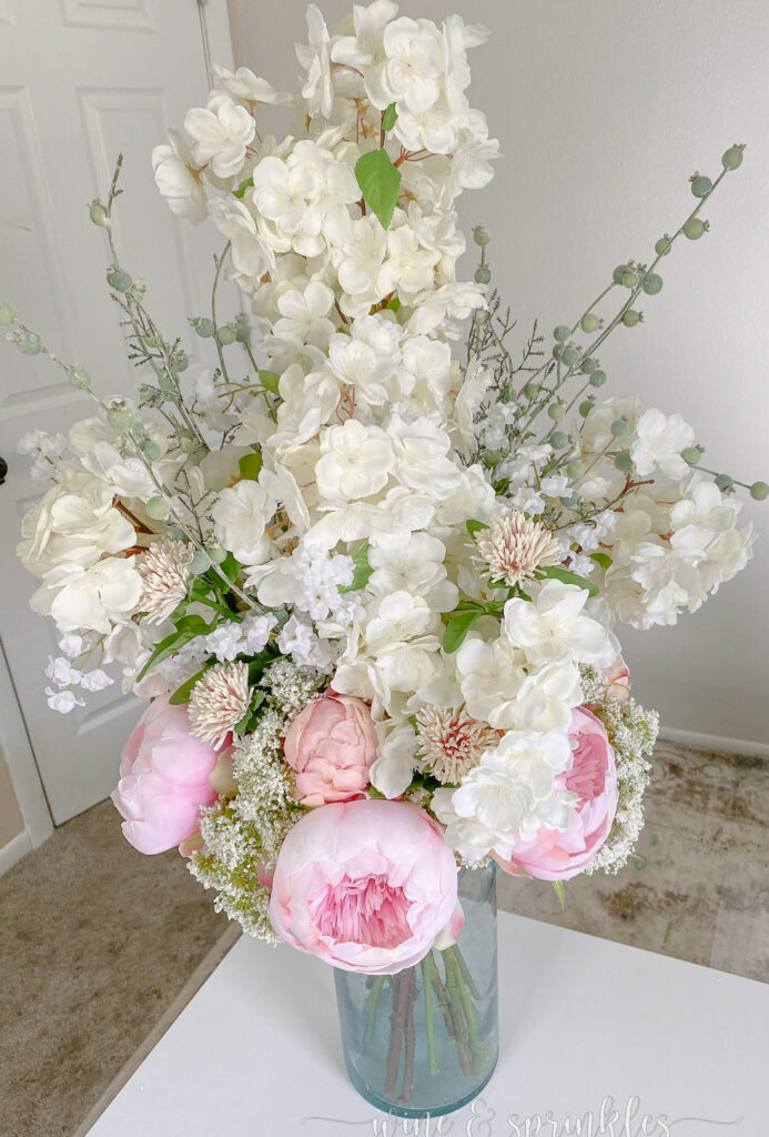spring floral centerpiece with pink hydrangeas and white flowers