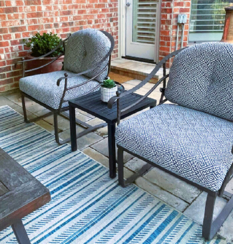 updated patio with blue and white striped run and meta side table