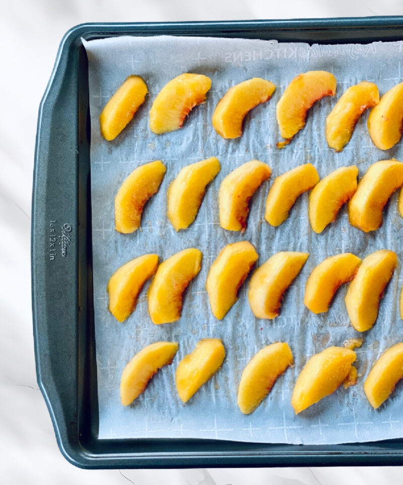 sliced peaches on a sheet pan